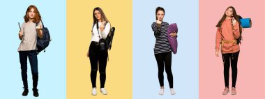 Bir grup gezgin kadın, fotoğrafçı, öğrenci ve pijamalarıyla boynuz hareketi yapıyorlar.