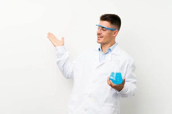 Young Scientific Holding Laboratory Flask Isolated Background Surprise Facial Expression — Stock Photo, Image