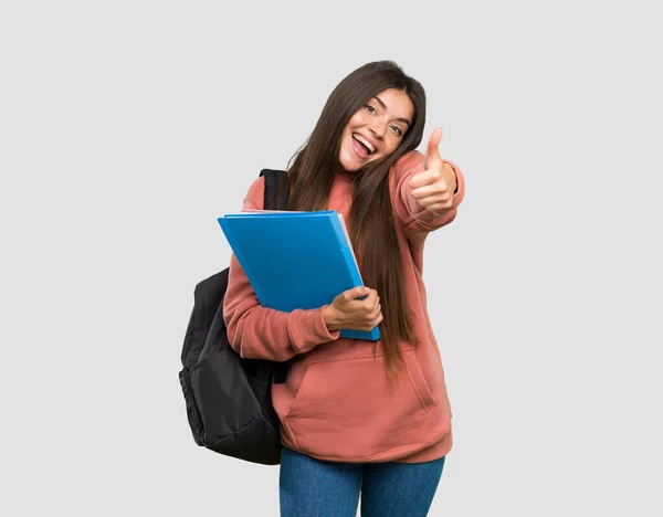 Young Student Woman Holding Notebooks Thumbs Because Something Good Has — Stock Photo, Image