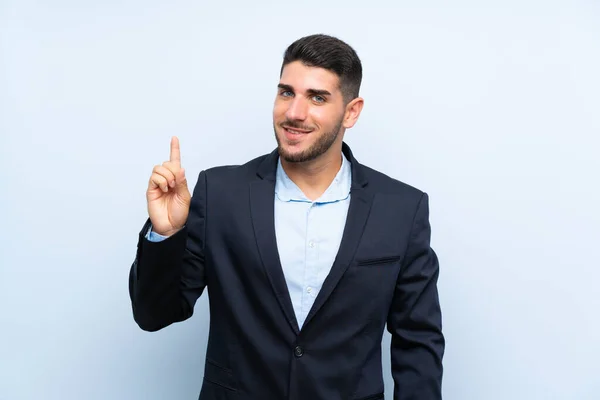 Hombre Guapo Sobre Fondo Azul Aislado Mostrando Levantando Dedo Señal — Foto de Stock