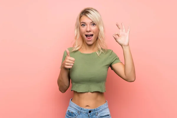 Young Blonde Woman Isolated Pink Background Showing Sign Thumb Gesture — ストック写真