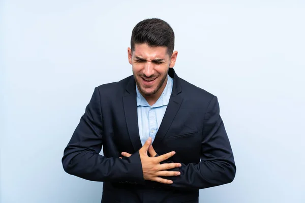 Hombre Guapo Sobre Fondo Azul Aislado Sonriendo Mucho —  Fotos de Stock