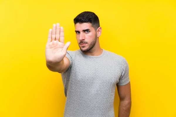 Joven Guapo Hombre Sobre Aislado Amarillo Fondo Haciendo Stop Gesto — Foto de Stock