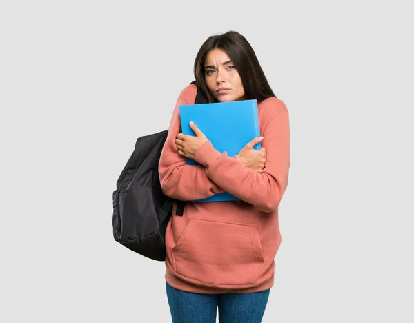 Jovem Estudante Mulher Segurando Notebooks Congelamento Sobre Fundo Cinza Isolado — Fotografia de Stock