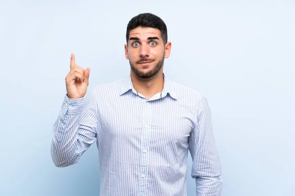 Caucasian Handsome Man Isolated Blue Background Pointing Index Finger Great — Stock Photo, Image