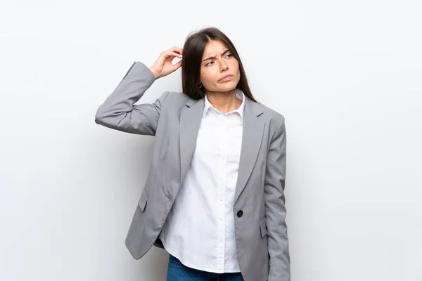 Young Business Woman Isolated White Background Having Doubts While Scratching — Stock Photo, Image