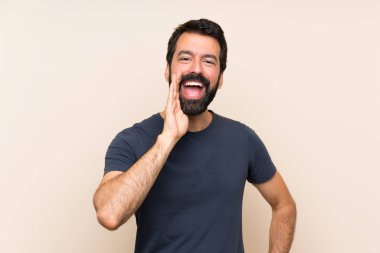 Man with beard shouting with mouth wide open