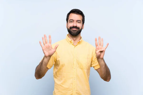 Jongeman Met Baard Geïsoleerde Blauwe Achtergrond Tellen Negen Met Vingers — Stockfoto