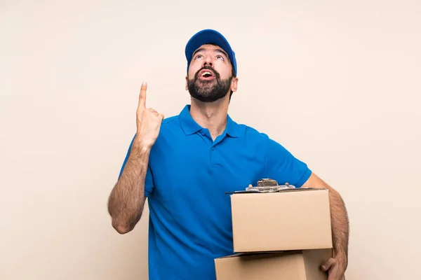 Delivery Man Beard Isolated Background Pointing Surprised — Stock Photo, Image