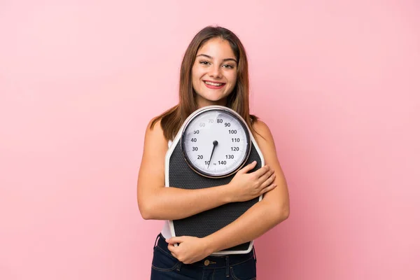 Young brunette girl over isolated background — Stock Photo, Image