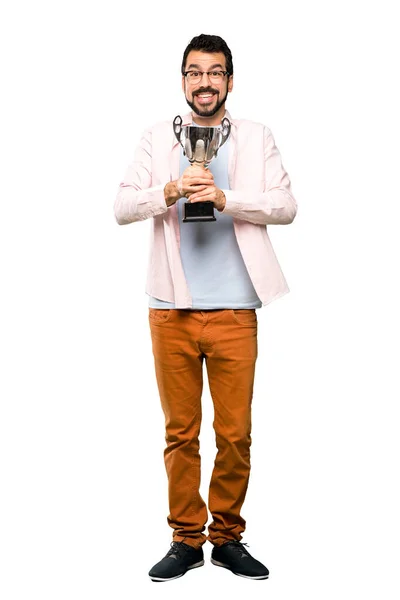 Hombre guapo con barba sosteniendo un trofeo —  Fotos de Stock