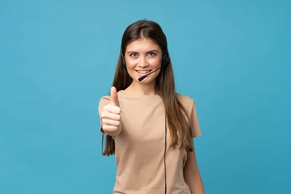 Young Woman Isolated Blue Background Working Headset Thumb — 图库照片