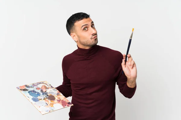 Joven Sobre Fondo Blanco Aislado Sosteniendo Una Paleta — Foto de Stock