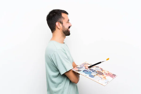 Joven Artista Sosteniendo Una Paleta Sobre Fondo Aislado Posición Lateral —  Fotos de Stock