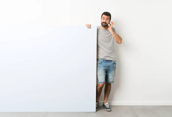 Young Handsome Man Beard Holding Big Blue Empty Placard Having — Stock Photo, Image