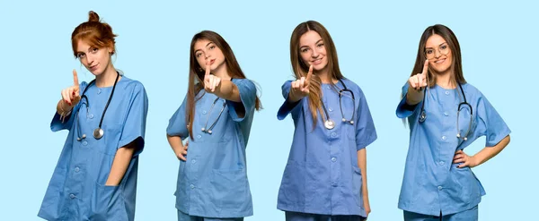 Group Nurses Showing Lifting Finger — Stock Photo, Image