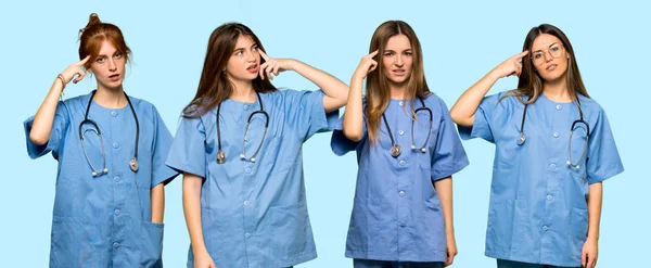 Grupo Enfermeiras Fazendo Gesto Loucura Colocando Dedo Cabeça — Fotografia de Stock
