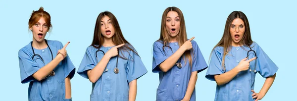 Group Nurses Surprised Pointing Side — Stock Photo, Image