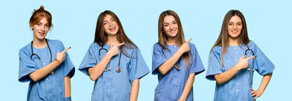 Group Nurses Pointing Side Present Product — Stock Photo, Image