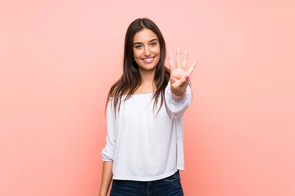 Mujer Joven Sobre Fondo Rosa Aislado Feliz Contando Cuatro Con — Foto de Stock