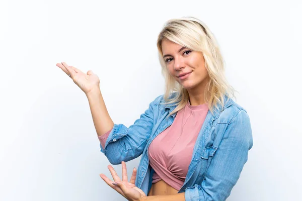 Young Blonde Woman Isolated White Background Extending Hands Side Inviting — Stock Photo, Image
