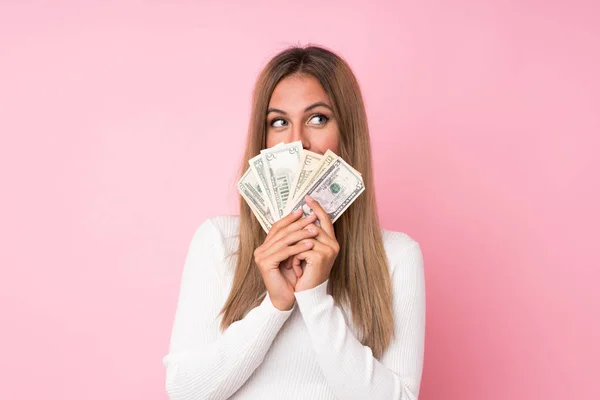 Young Blonde Woman Isolated Pink Background Taking Lot Money — Stock Photo, Image