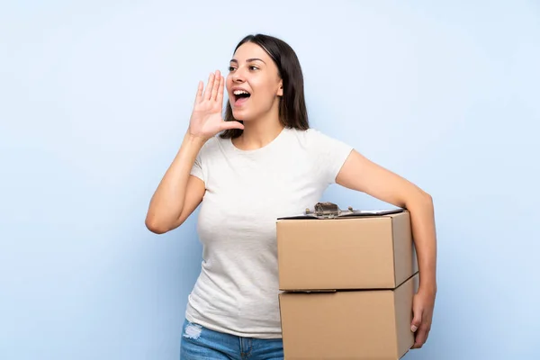 Young Delivery Woman Blue Brick Wall Shouting Mouth Wide Open — Stock Photo, Image