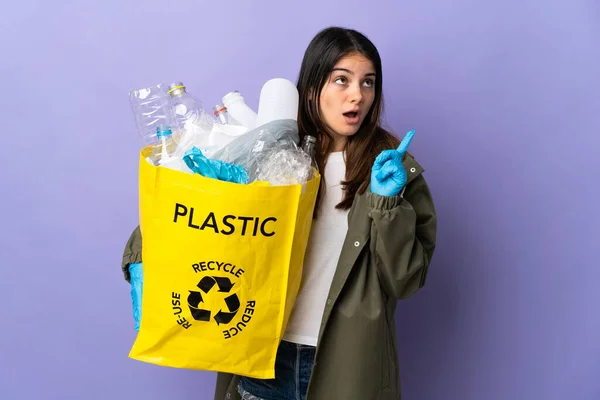 Young Woman Holding Bag Full Plastic Bottles Recycle Isolated Purple — Stock Photo, Image