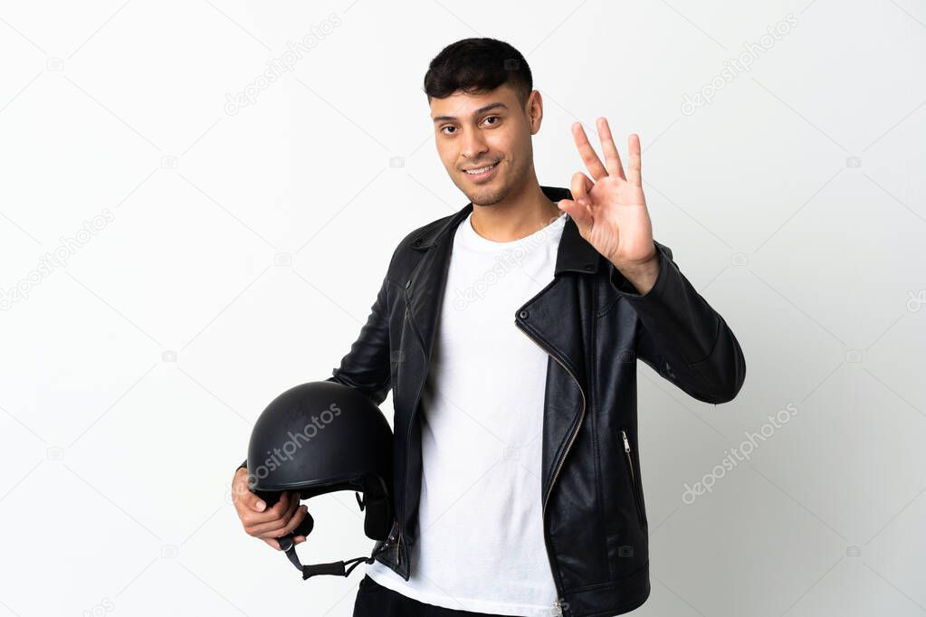 Man with a motorcycle helmet isolated on white background happy and counting three with fingers