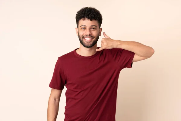 Young Moroccan Man Isolated Beige Background Making Phone Gesture Call — Stock Photo, Image