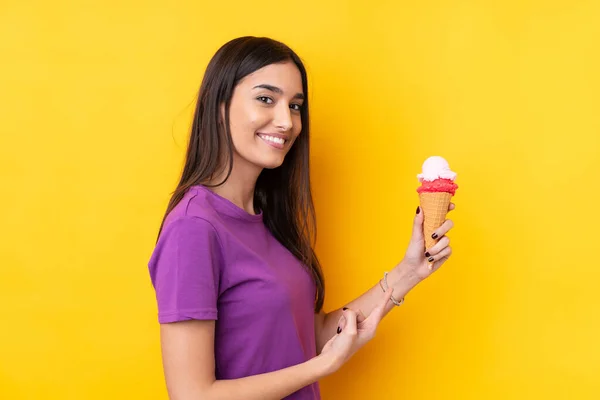 Young Brunette Woman Cornet Ice Cream Isolated Yellow Background Pointing — Stock Photo, Image