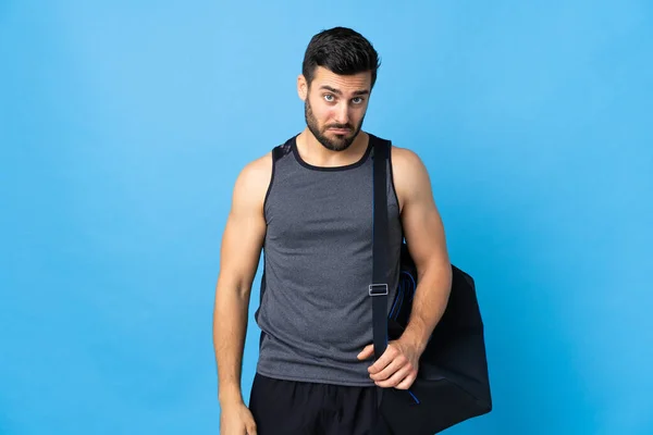 Jeune Homme Sport Avec Sac Sport Isolé Sur Fond Bleu — Photo