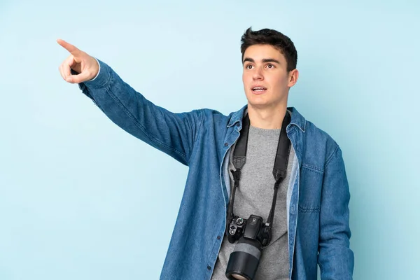 Teenager Photographer Man Isolated Blue Background Pointing Away — Stock Photo, Image