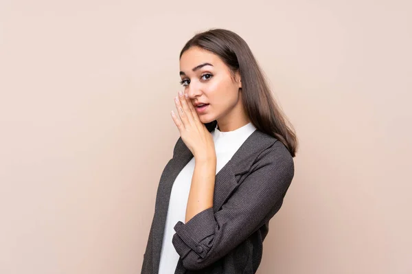 Jovencita Sobre Fondo Aislado Susurrando Algo —  Fotos de Stock