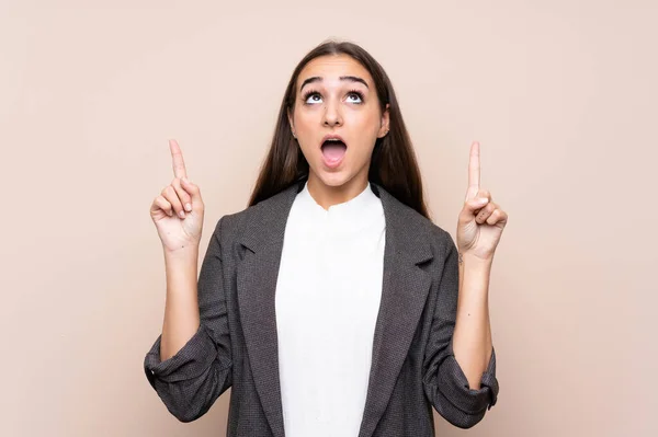 Chica Joven Sobre Fondo Aislado Señalando Con Dedo Índice Una — Foto de Stock