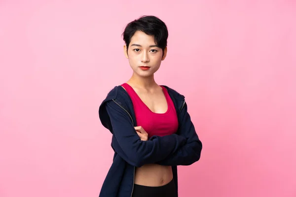 Mladý Sport Asijské Žena Přes Izolované Růžové Pozadí Udržet Paže — Stock fotografie