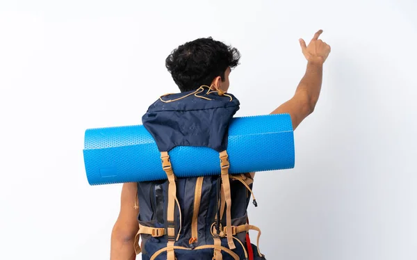 Young Argentinian Hiker Man Isolated White Background Pointing Back Index — Stock Photo, Image