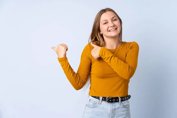 Teenager Ukrainian Girl Isolated Blue Background Pointing Side Present Product — Stock Photo, Image