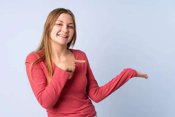 Teenager Ukrainian Girl Isolated Blue Background Holding Copyspace Imaginary Palm — Stock Photo, Image