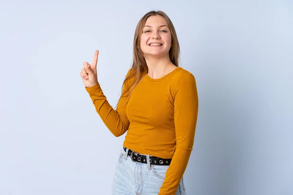 Подросток Украинская Девушка Изолированы Синем Фоне Показывая Поднимая Палец Знак — стоковое фото