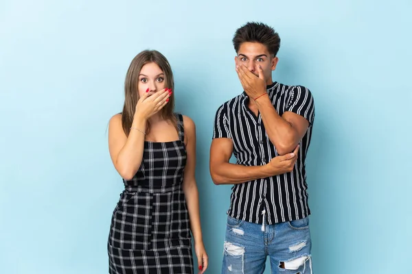 Teenager Caucasian Couple Isolated Blue Background Covering Mouth Hands Saying — Stock Photo, Image