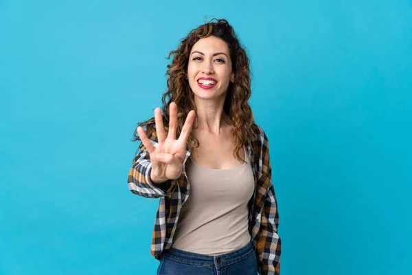 Jonge Kaukasische Vrouw Geïsoleerd Blauwe Achtergrond Gelukkig Tellen Vier Met — Stockfoto