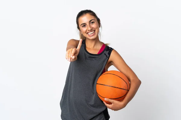若いですヒスパニック女性遊びバスケットボール上の隔離された白い背景ショーと持ち上げる指 — ストック写真