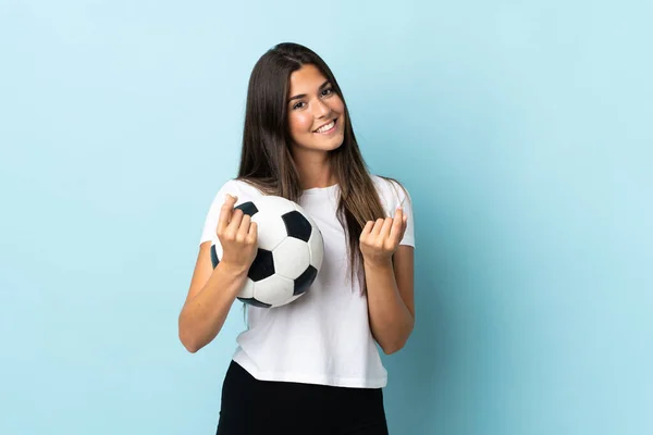 Młody Piłkarz Brazylijski Dziewczyna Odizolowany Niebieskim Tle Pieniądze Gest — Zdjęcie stockowe