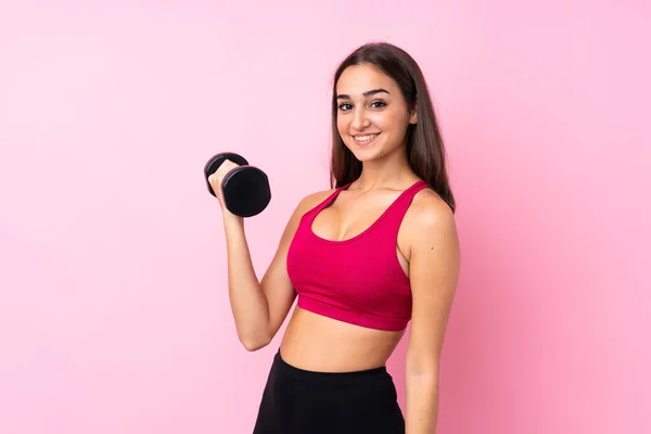Jong Sport Meisje Geïsoleerde Roze Achtergrond Maken Gewichtheffen — Stockfoto