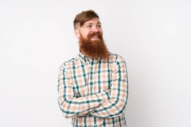 Kızıl saçlı, uzun sakallı, soyutlanmış beyaz bir geçmişi olan, kolları bağlı ve mutlu bir adam.