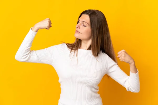 Young Slovak Woman Isolated Yellow Background Doing Strong Gesture — Stock Photo, Image