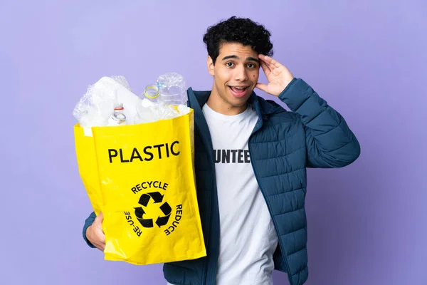 Young Venezuelan Man Holding Bag Full Plastic Bottles Surprise Expression — Stock Photo, Image