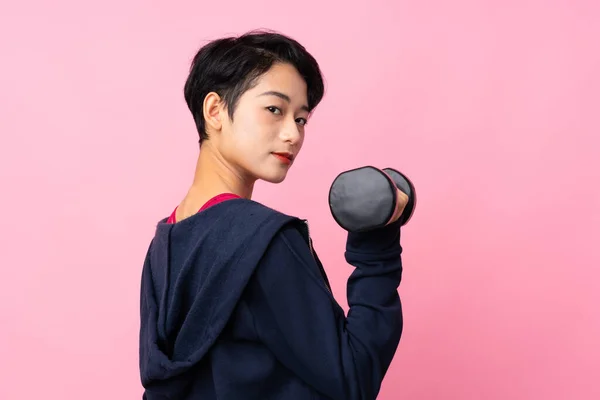 Junge Sport Asiatische Frau Über Isolierte Rosa Hintergrund Machen Gewichtheben — Stockfoto