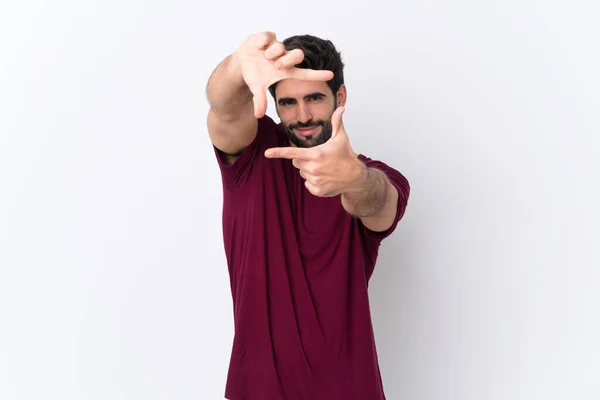 Joven Hombre Guapo Con Barba Sobre Fondo Blanco Aislado Enfocando —  Fotos de Stock